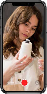 Woman testing an electronic device with wires during a real-world product evaluation.