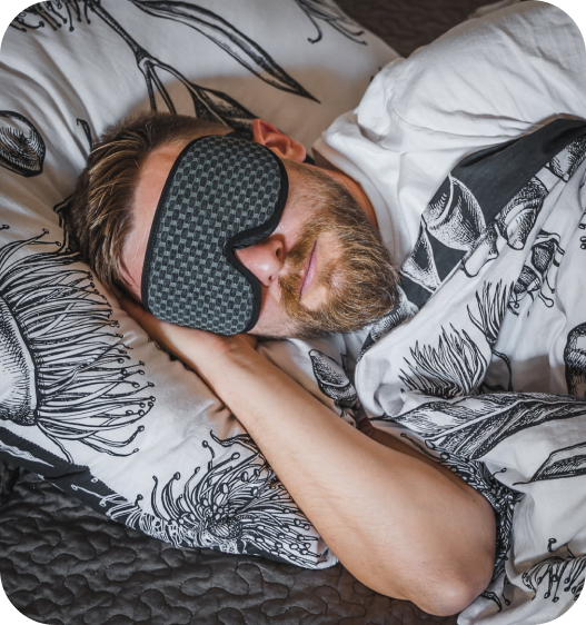 Man wearing sleep mask during a diary study project.