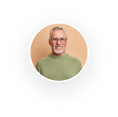 Profile of an elderly man with glasses in a user circle icon.